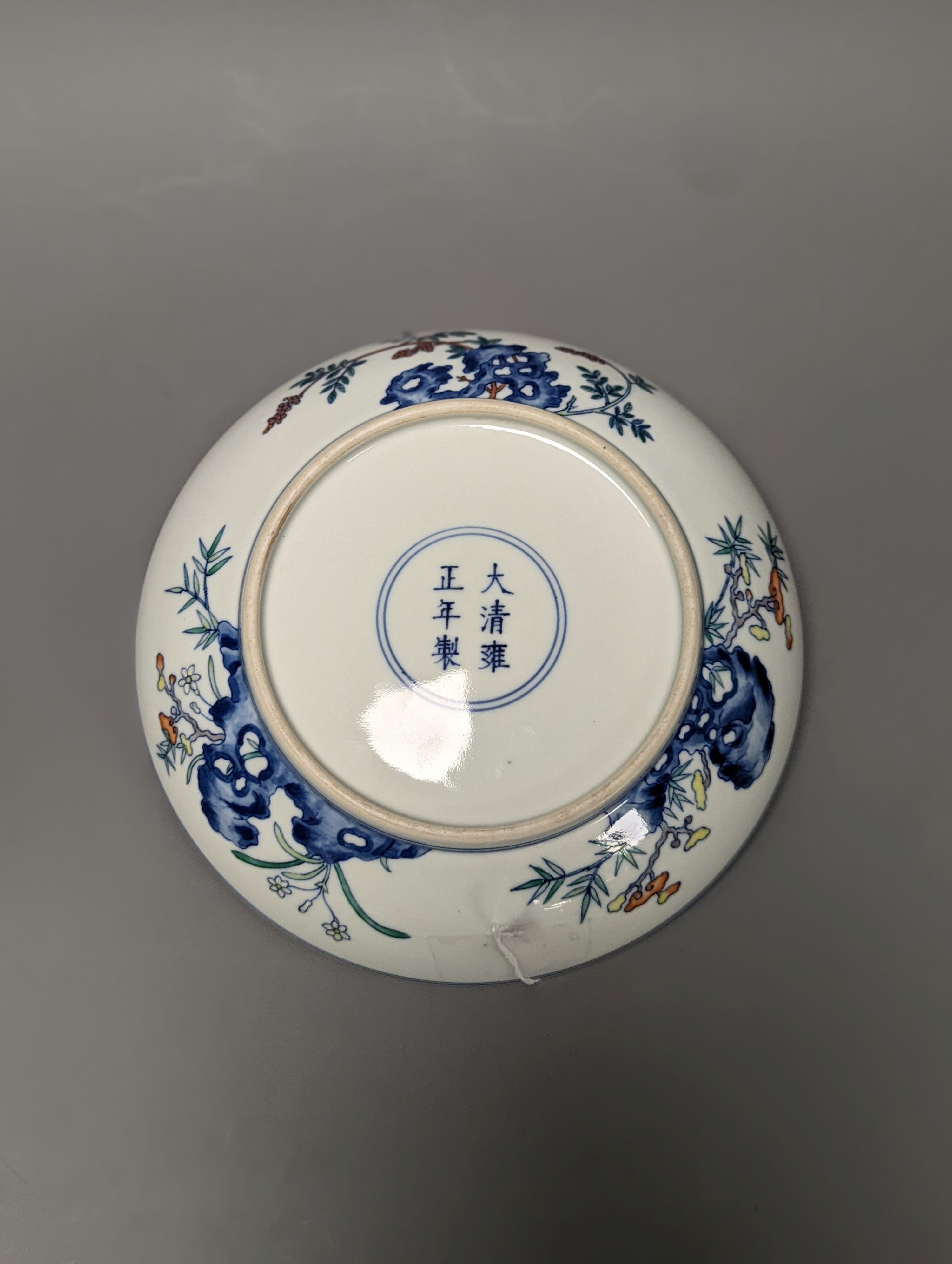 A Chinese doucai saucer dish, Yongzheng mark but later 20cm diameter